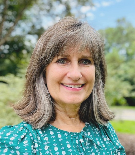 Smiling woman with gray hair